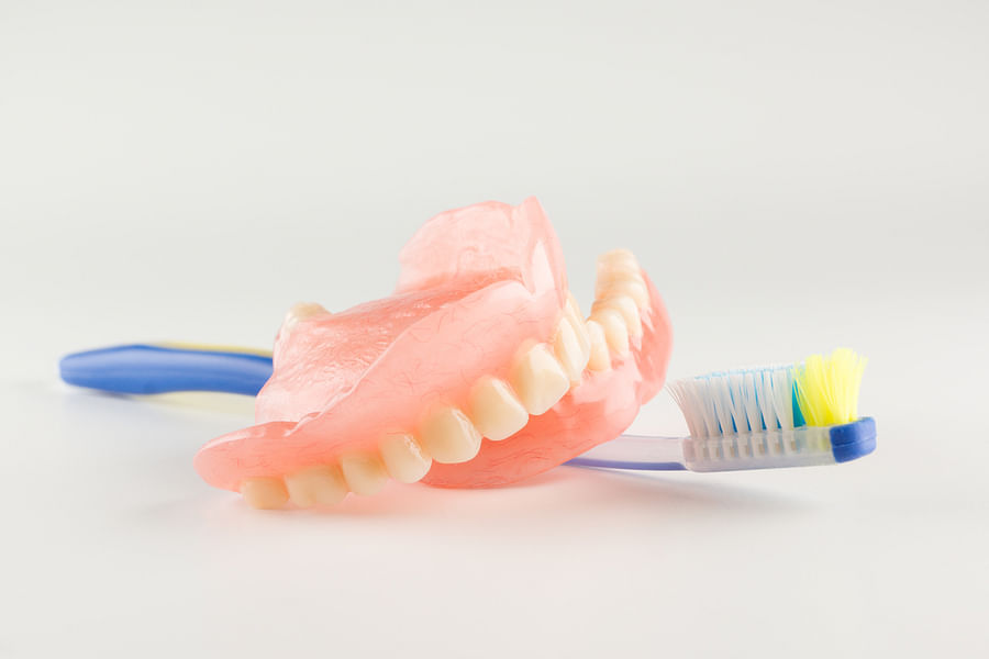 https://denturecareshop.com/image/articles/maximizing-your-denture-brush-use-for-optimal-denture-care-4f4ff3e080f6cc84.jpeg?w=900&source=odin&compress=true